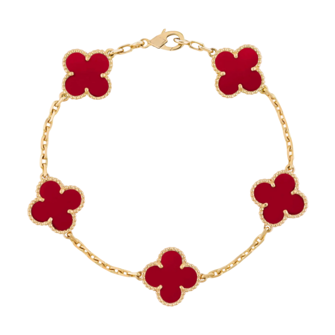 Gold bracelet with red clover-shaped charms on a white background