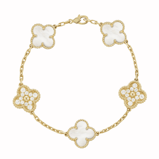 Gold bracelet with white clover-shaped charms on a white background