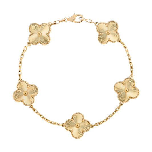 Gold luxecharm clover bracelet with floral design on a white background